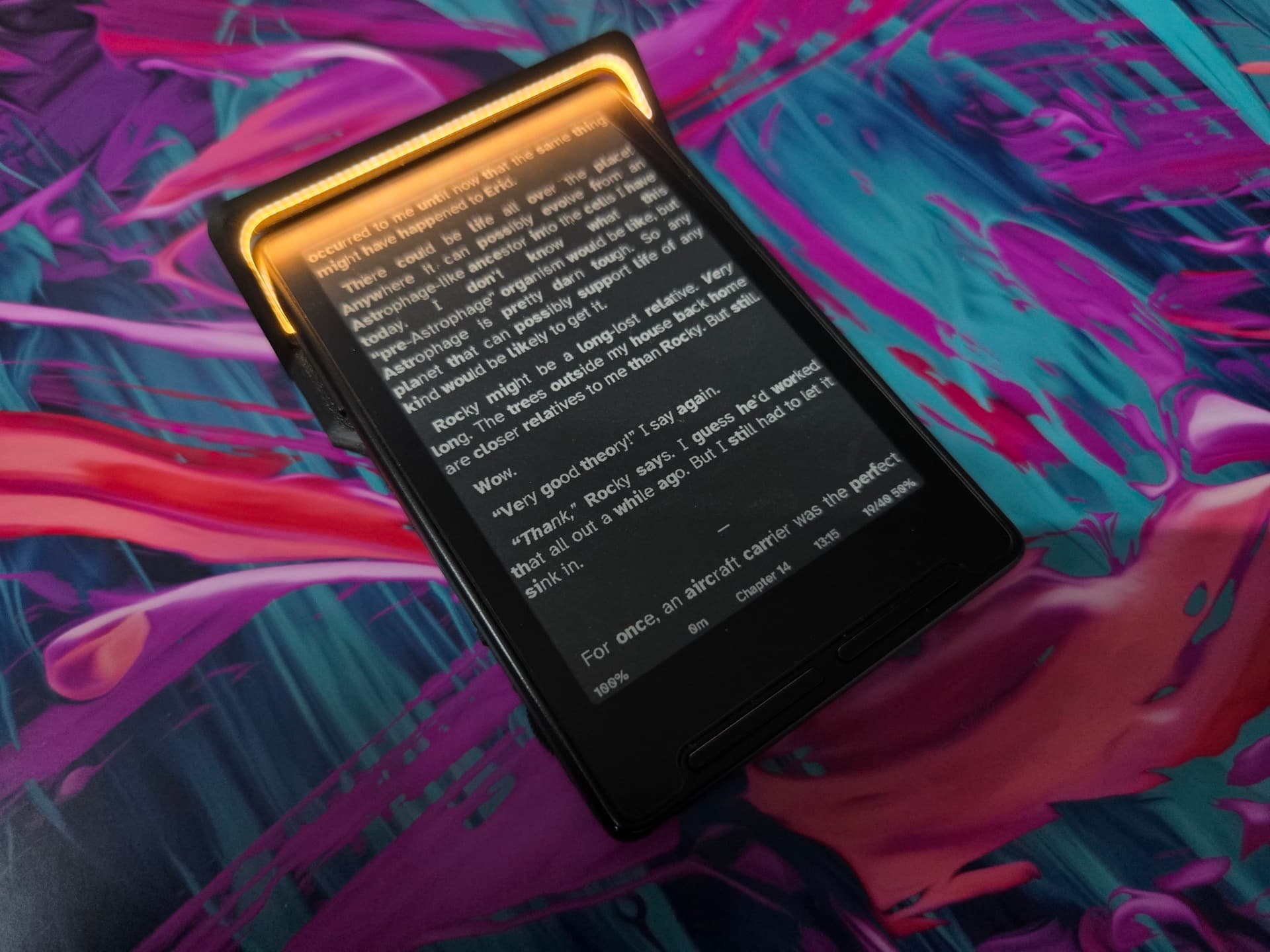 The X3 docked in the LightCharge, warm 2700K light washing across the e-ink page